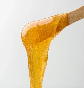 liquid-sugar-wax-on-spatula-2023-11-27-05-21-42-utc
